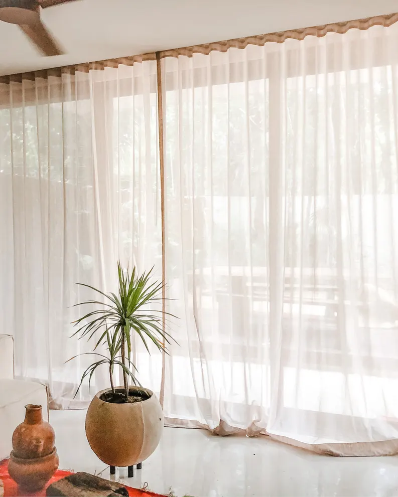 Natural light filtered through custom curtains